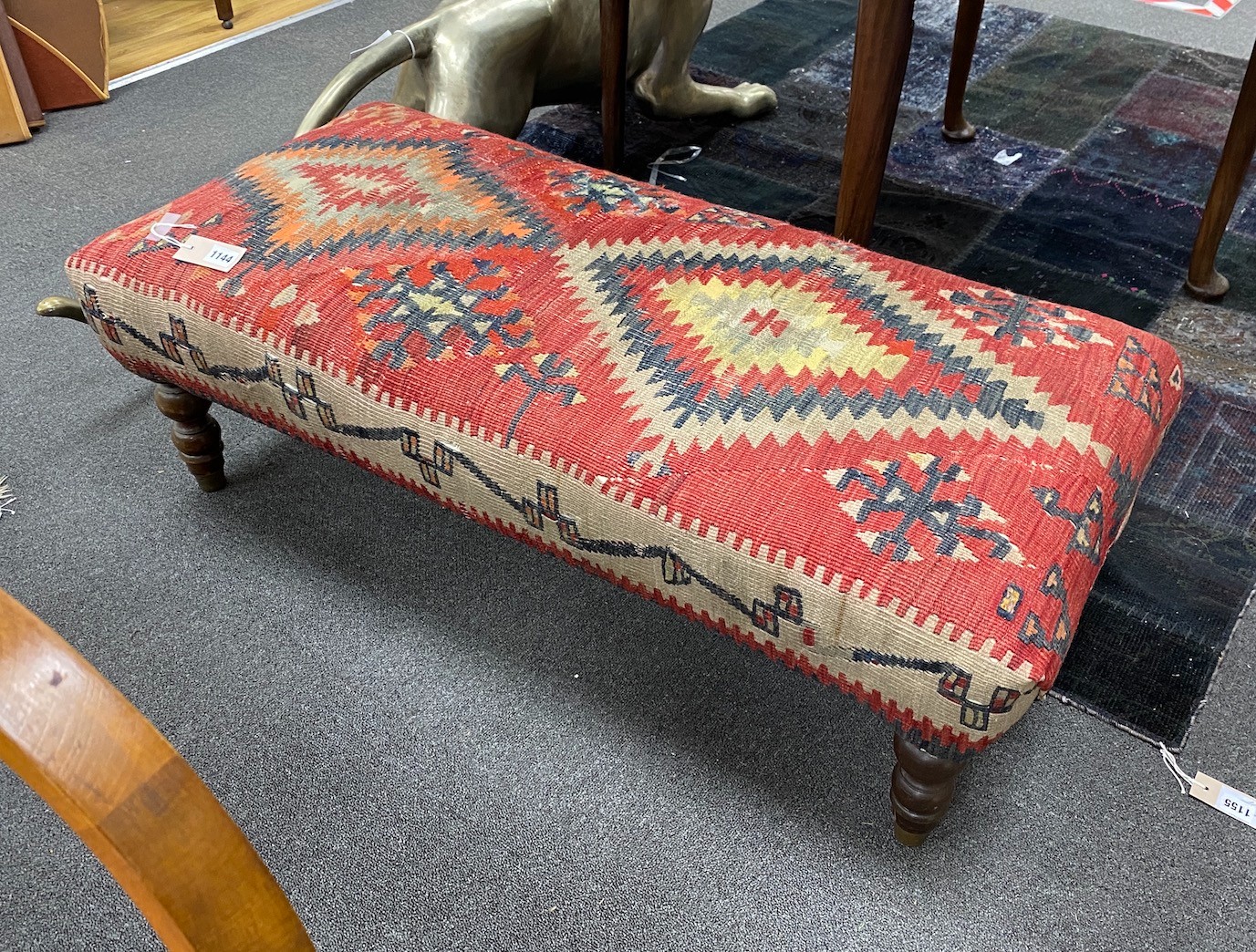 A Kelim covered long foot stool, length 108cm, depth 50cm, height 35cm